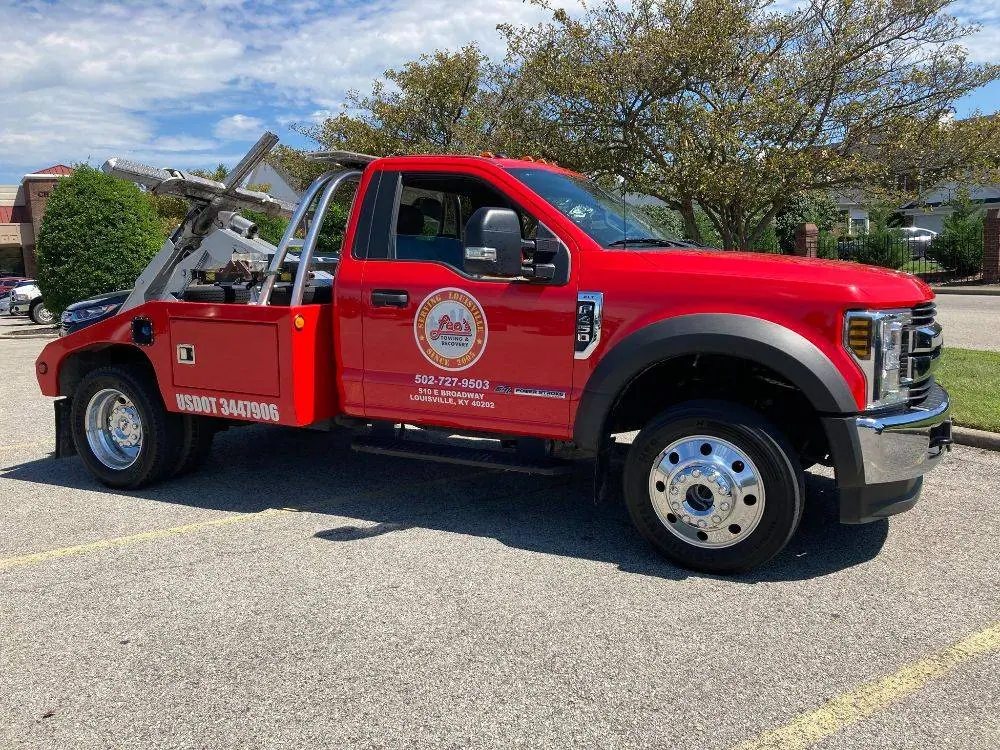Leo's red wrecker truck, front three-quarter view